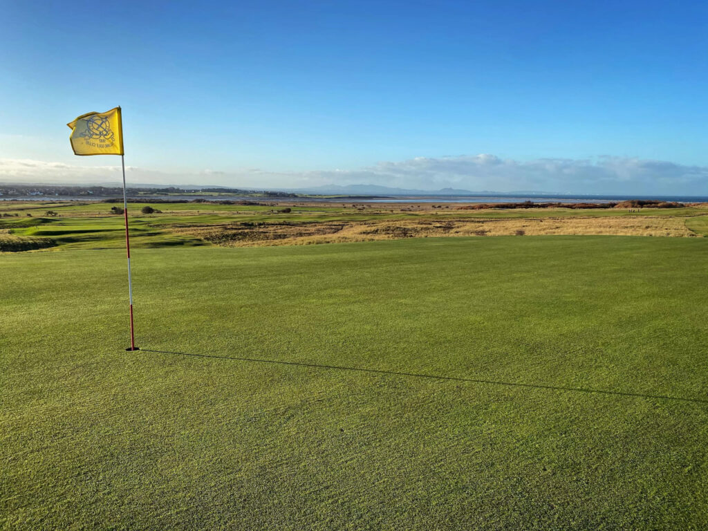 Hole with yellow flag at Gullane Golf Club – No. 3 Course