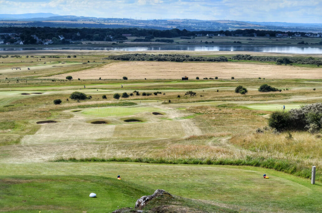 Aerial view of Gullane Golf Club – No. 3 Course with lake in distance