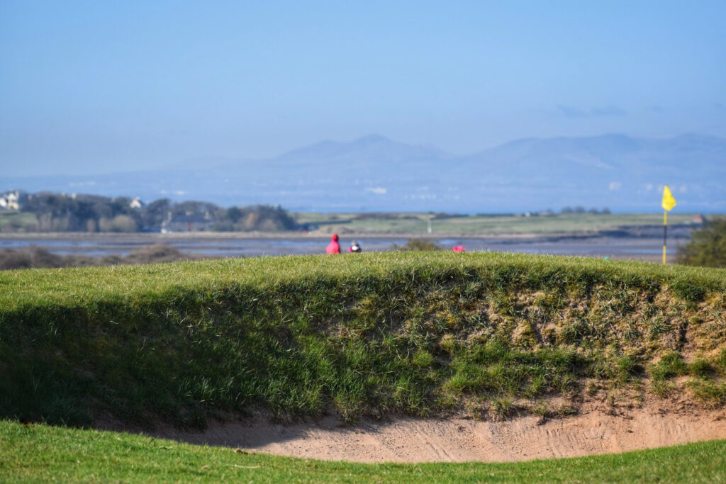 Bunker with yellow flag in background at Gullane Golf Club – No. 3 Course