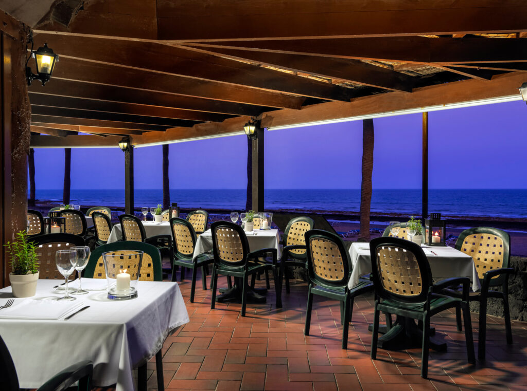 H10 Las Palmeras Hotel outdoor dining area with view