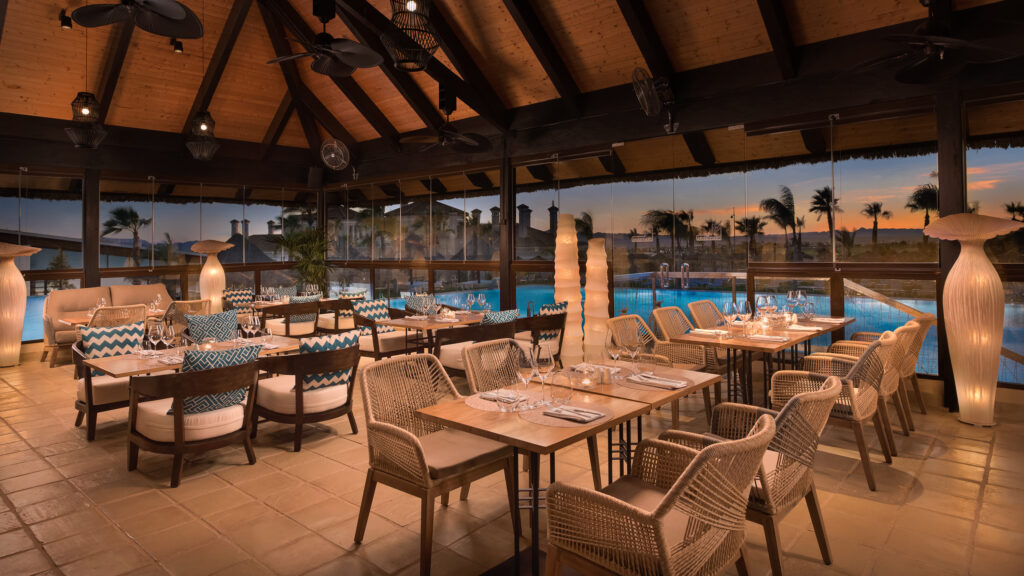 Restaurant at Hacienda Del Alamo Golf Resort with view of the outdoor pool