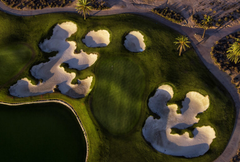 Aerial view of a hole at Hacienda Riquelme Golf Course with bunkers