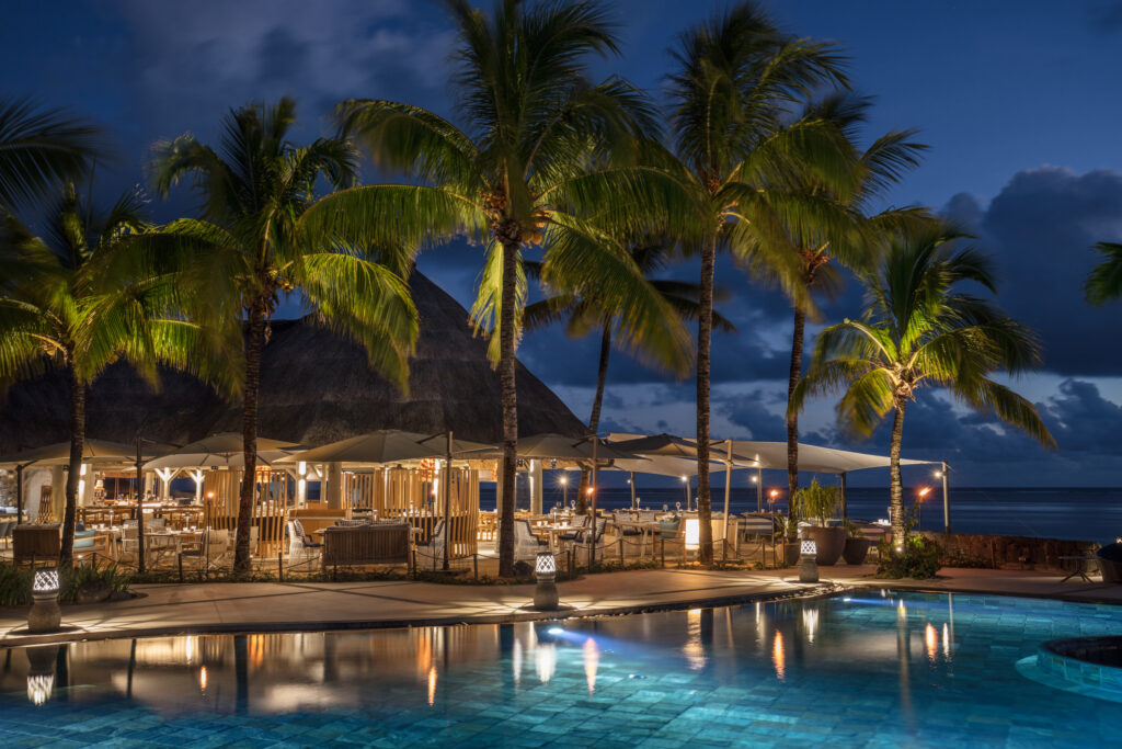 Outdoor pool with bar at Heritage Awali Golf and Spa Resort