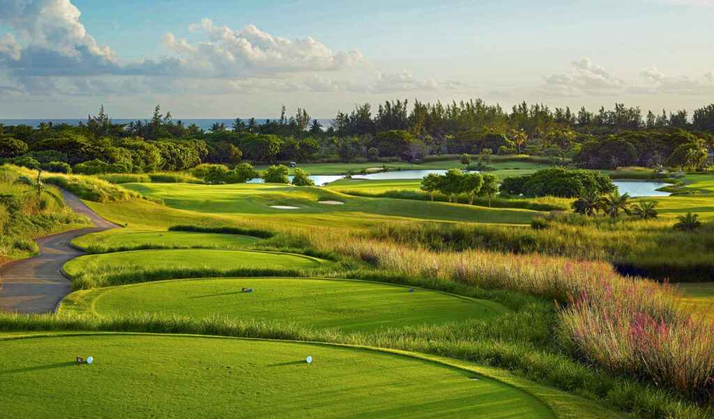 Tee box with view of lakes and trees at Heritage Golf Club - Le Chateau Course