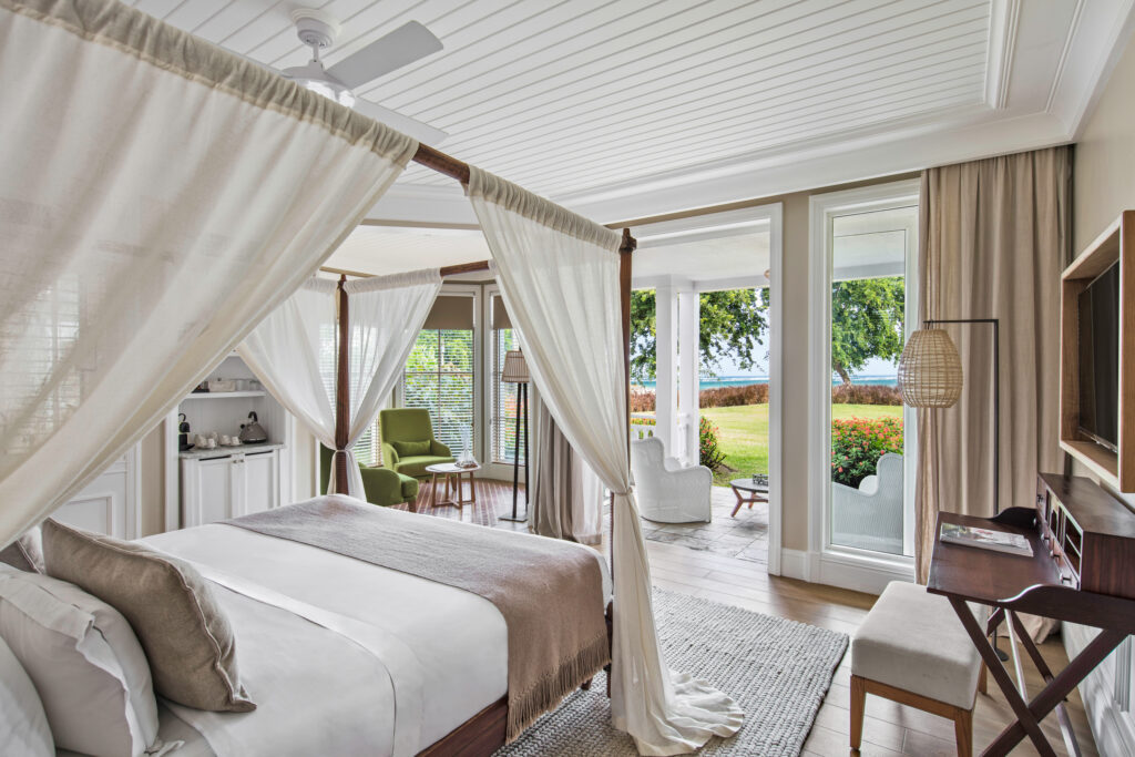 Double canopy bed accommodation with private terrace at Heritage Le Telfair