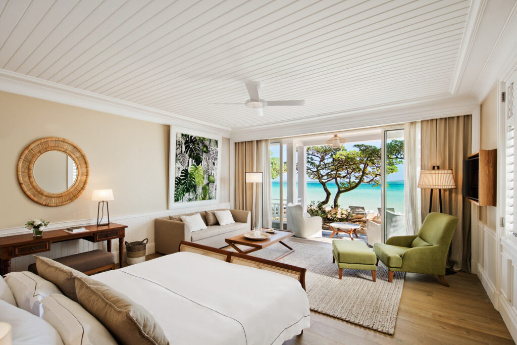 Double bed accommodation at Heritage Le Telfair with private terrace leading onto beach