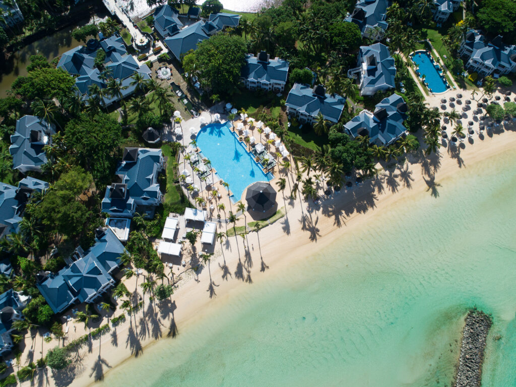 Aerial view of the beach and outdoor pool at Heritage Le Telfair