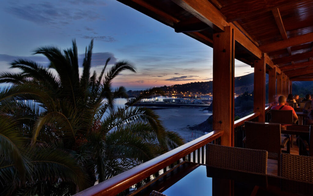 Balcony dining at Hotel do Mar with beach view