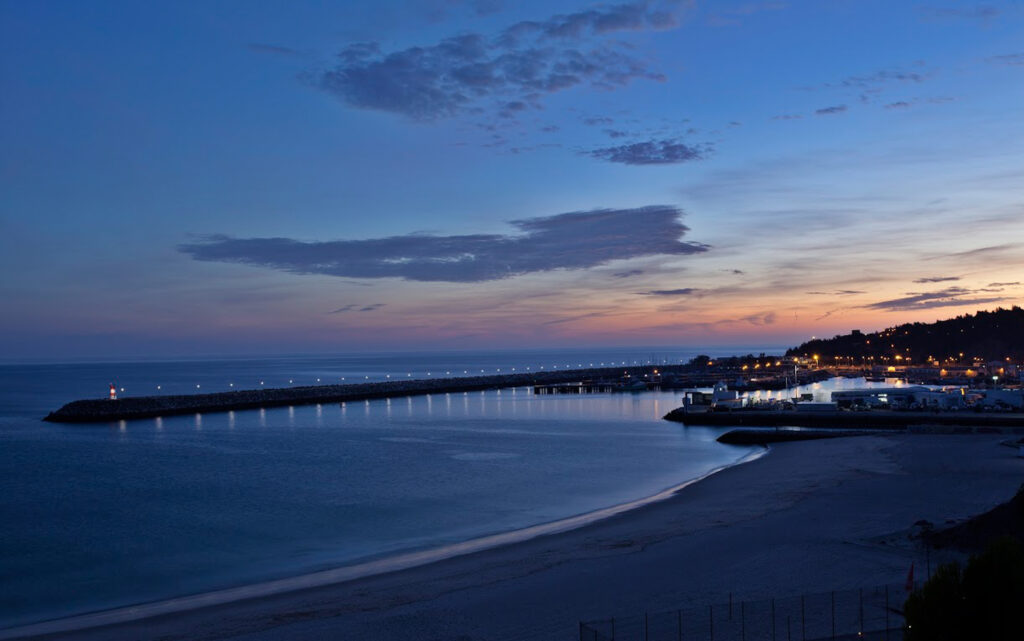 View of beach at Hotel do Mar at night