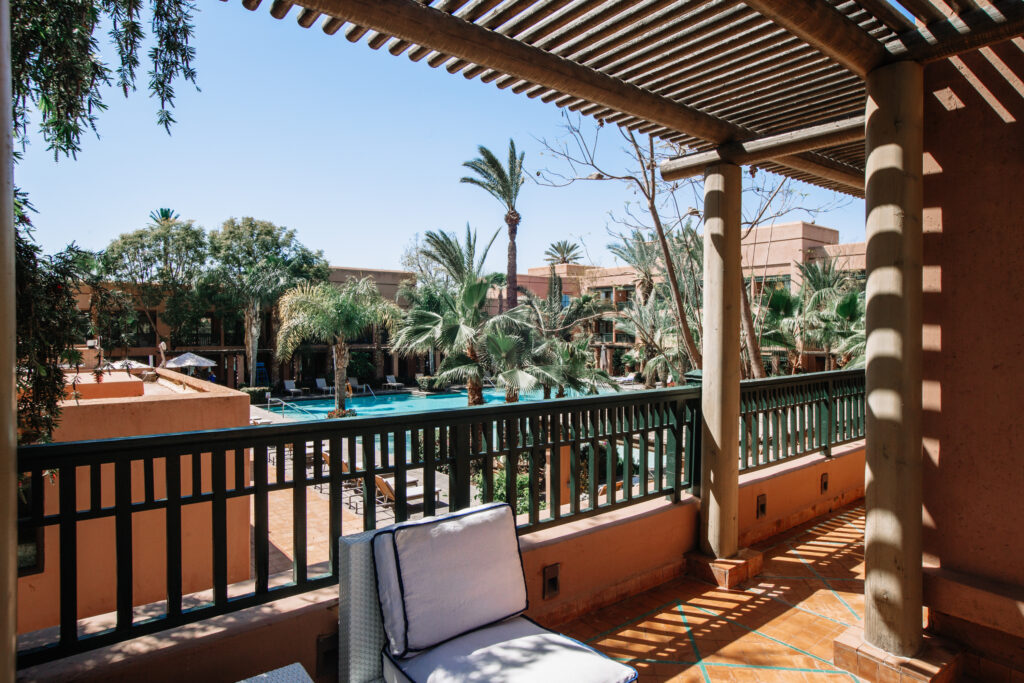 Balcony at Hotel du Golf Rotana with view of outdoor pool