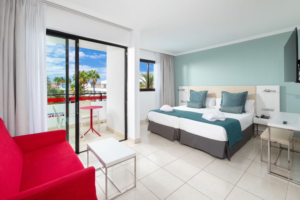 Hotel La Siesta bedroom with a balcony