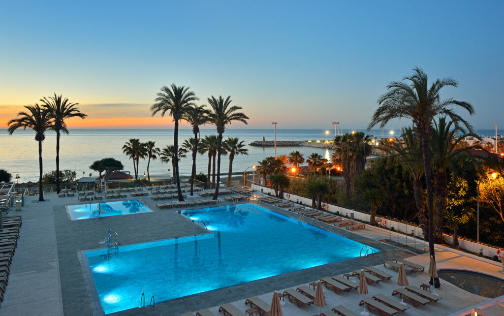 Outdoor pool at Hotel Ocean House Costa Del Sol at sunset