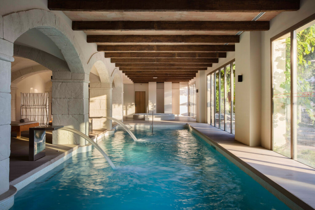 Indoor pool at Hotel Peralada with fountains