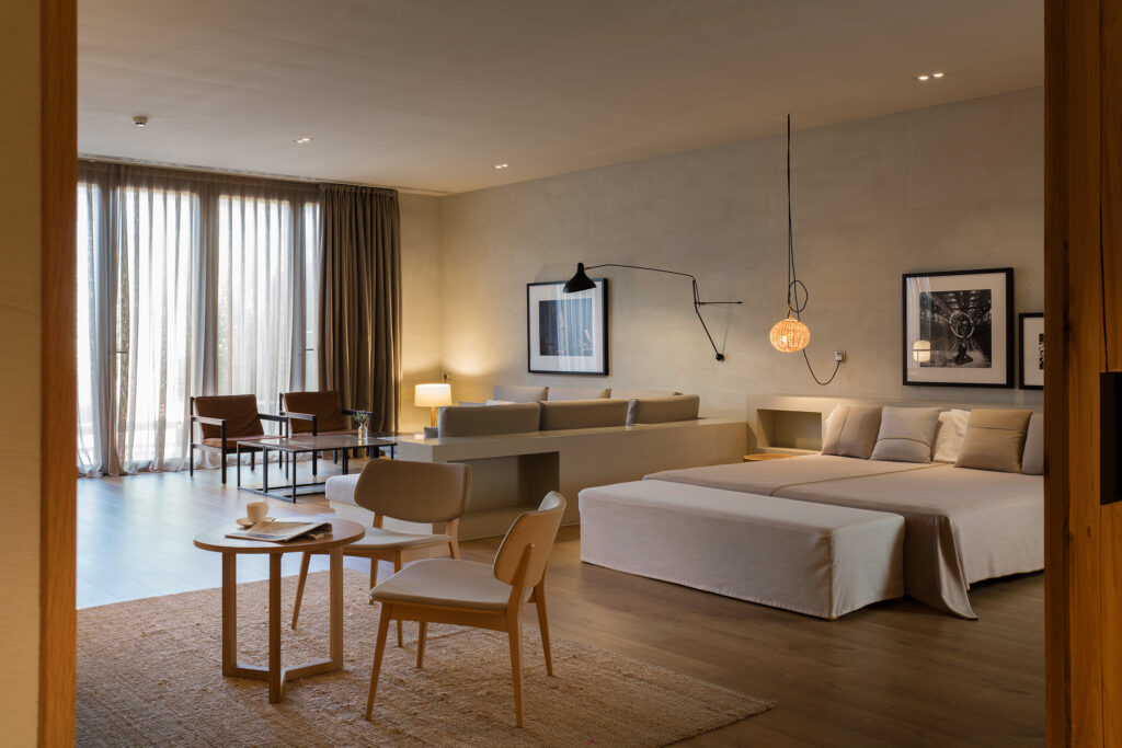 Double bed accommodation with living area at Hotel Peralada