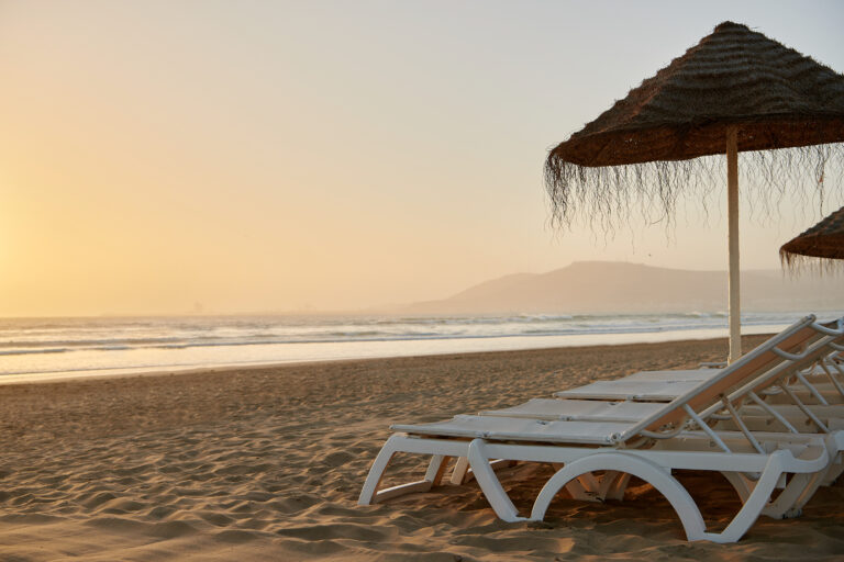 Loungers on beach atIberostar Founty Beach Hotel at sunset