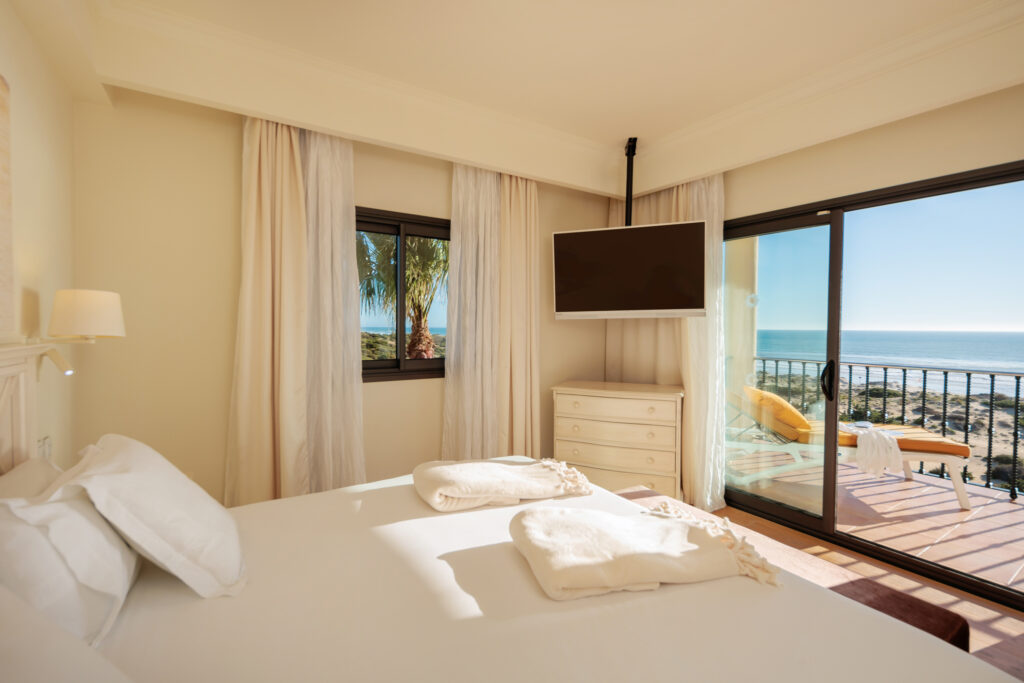 Double bed accommodation with balcony and beach view at Iberostar Selection Andalucia Playa