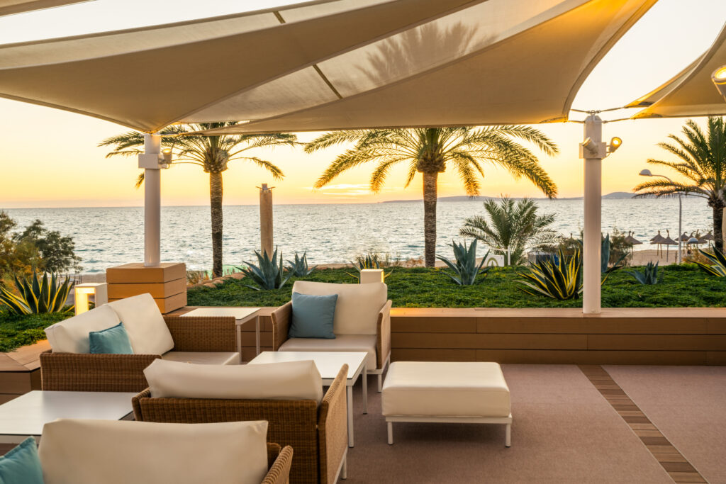 Outdoor seating area with ocean view at Iberostar Selection Playa de Palma