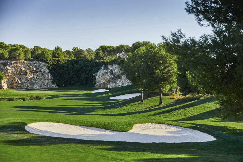 Bunkers on fairway with trees around at Infinitum Hills Course