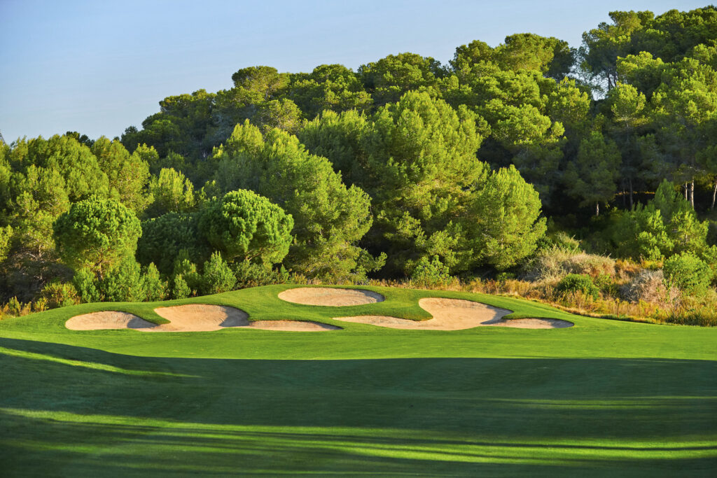 Bunkers on fairway with trees around at Infinitum Hills Course