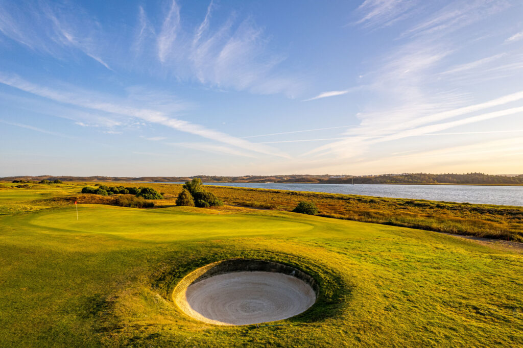 Hole with bunker and lake in the background at Isla Canela Links