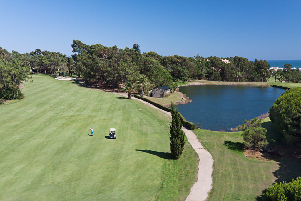 Aerial view of Islantilla Golf Course with buggy and lake