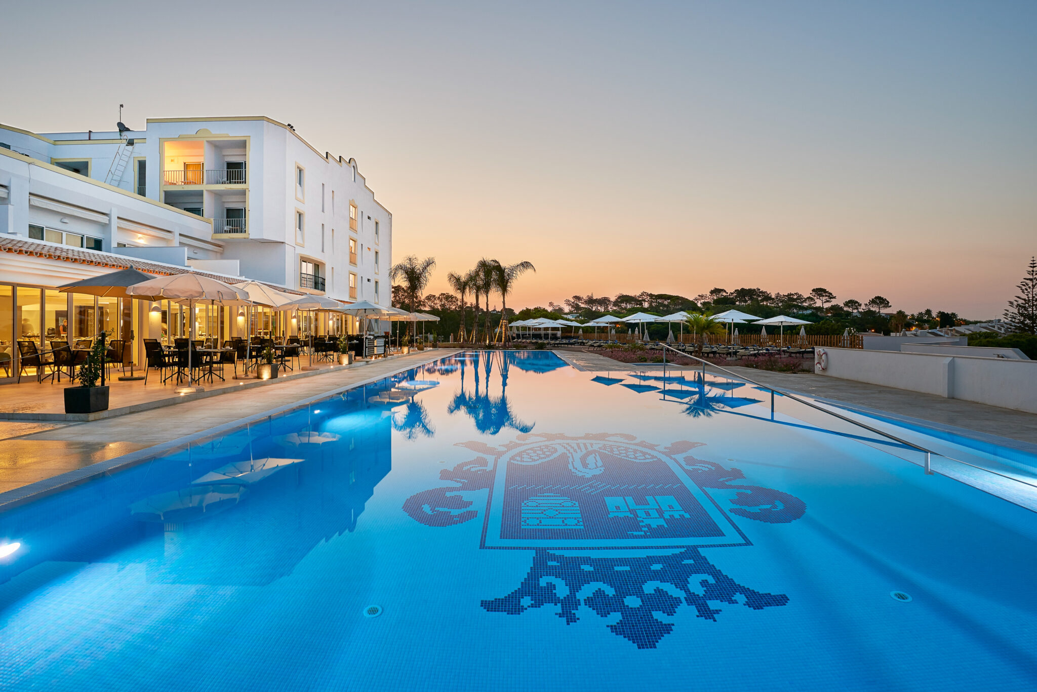 Outdoor Pool at sunset at Hotel Dona Filipa