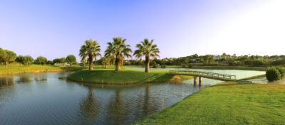 Lake with bridge on fairway at Pinheiros Altos Golf Course