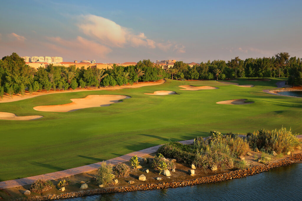 Fairway with bunkers and trees around at Abu Dhabi Golf Club - National