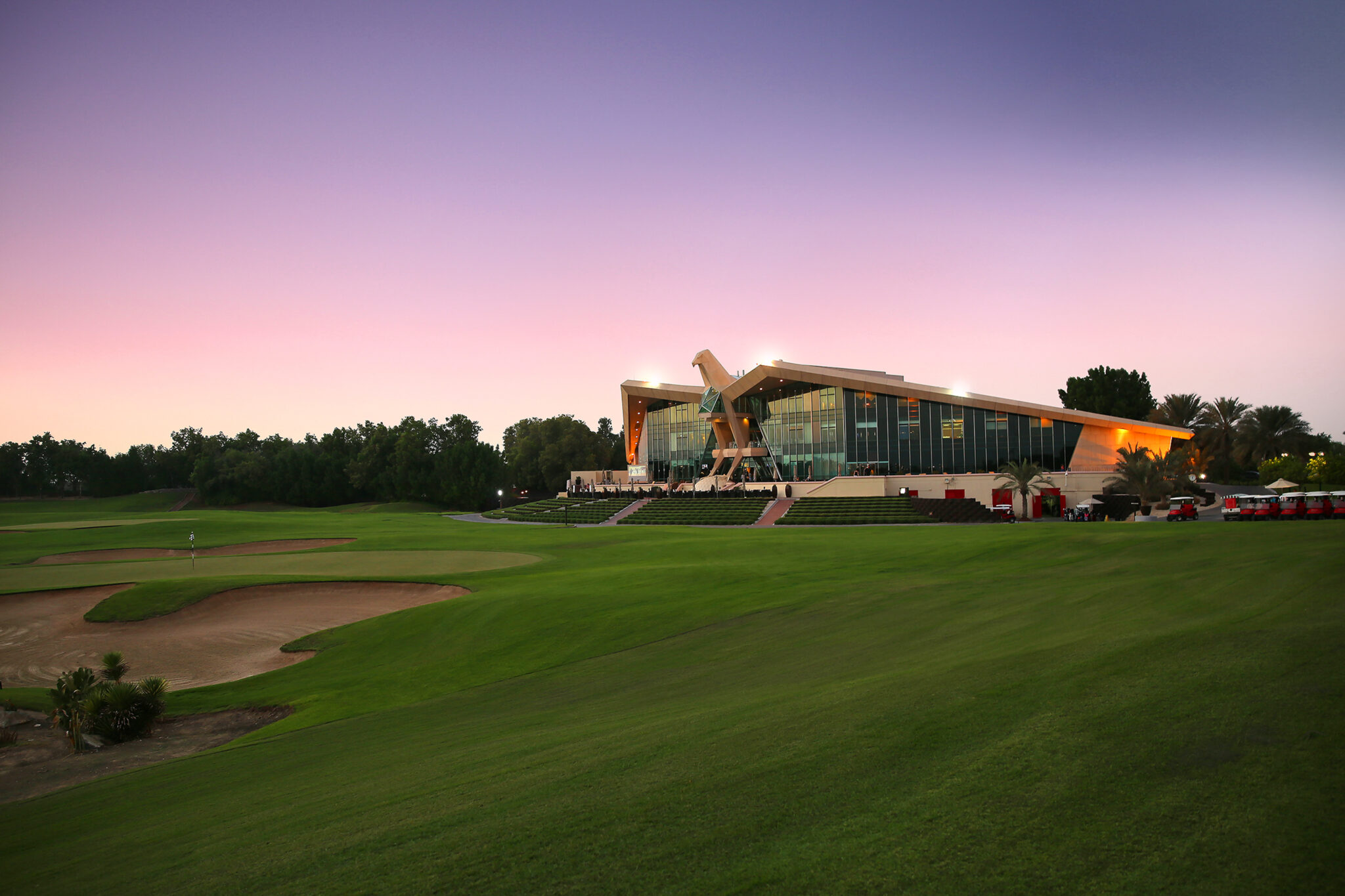 Fairway with building in background at Abu Dhabi Golf Club - National