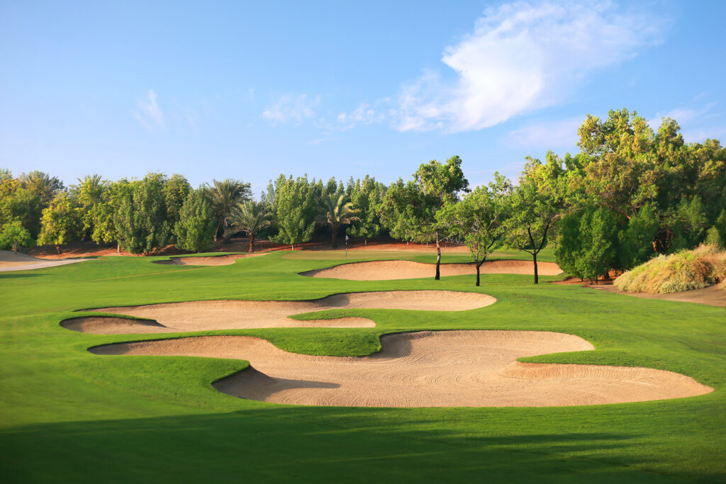 Fairway with bunkers at Abu Dhabi Golf Club - National with trees around