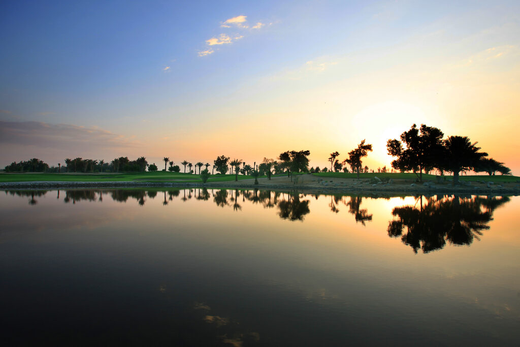 Lake on the fairway at Abu Dhabi Golf Club - National at sunset