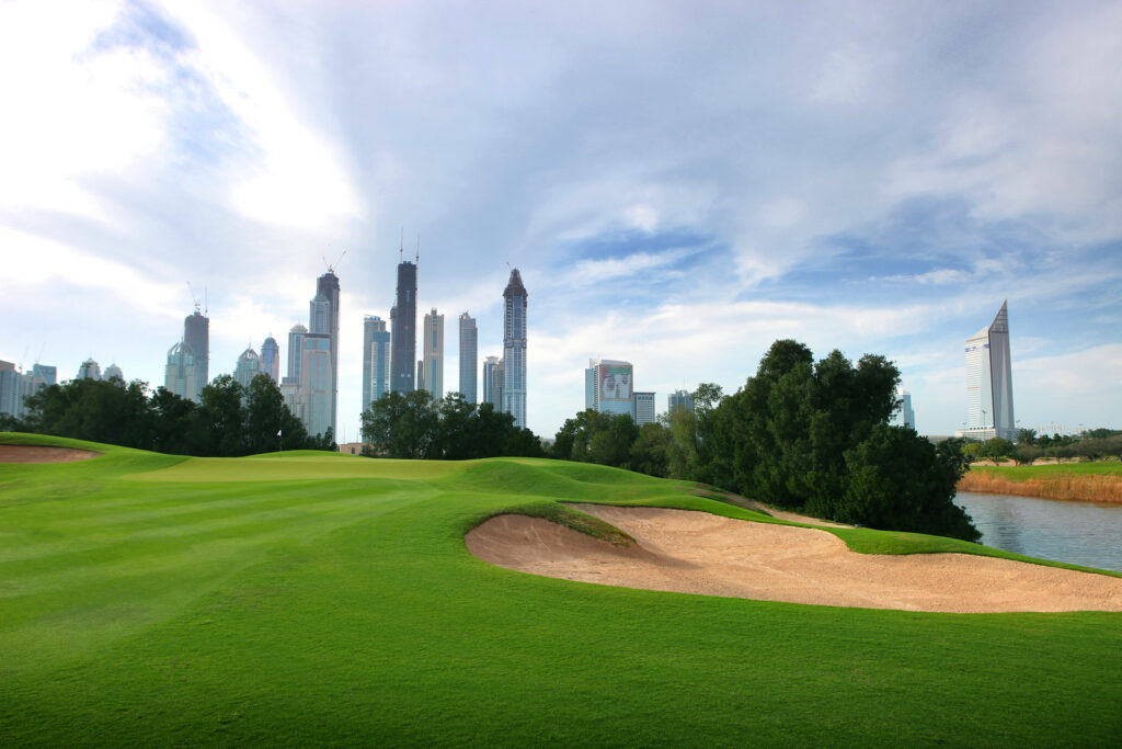 Bunker on fairway at Abu Dhabi Golf Club - National with city in background