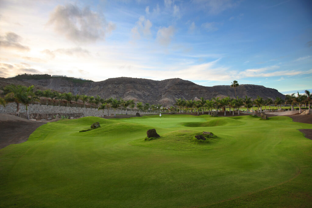 Fairway with hillsides and trees around at Anfi Tauro