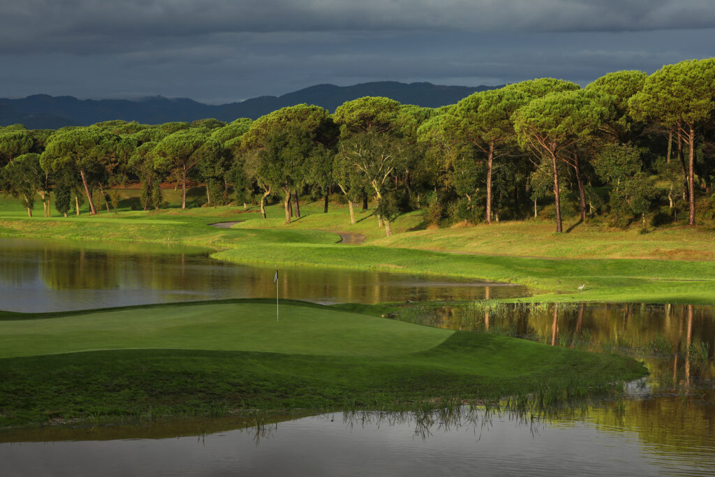 Fairway with lakes and trees around at Camiral Golf & Wellness - Stadium Course