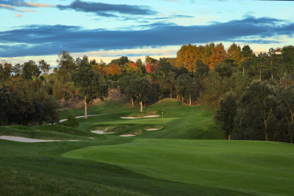 Fairway with bunkers and trees around at Camiral Golf & Wellness - Stadium Course