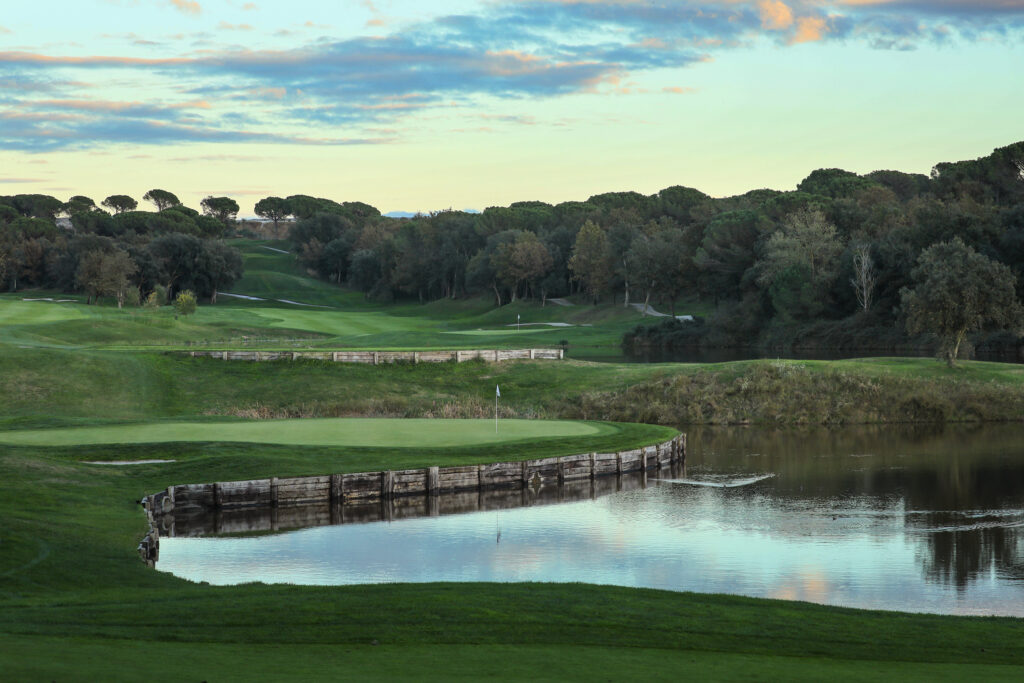 Fairway with lake and trees around at Camiral Golf & Wellness - Stadium Course