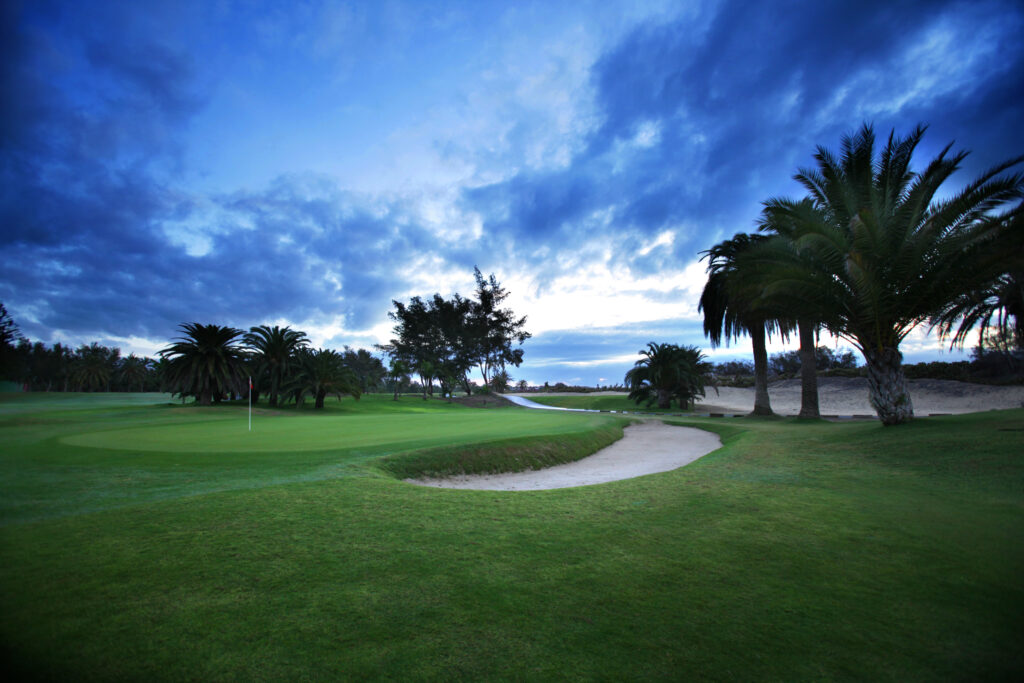 Hole with bunker and trees around at Campo de Golf de Maspalomas