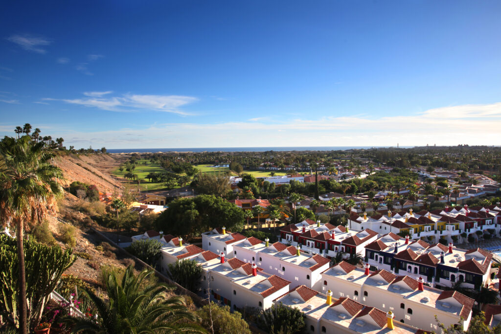 Aerial view of Campo de Golf de Maspalomas with buildings around