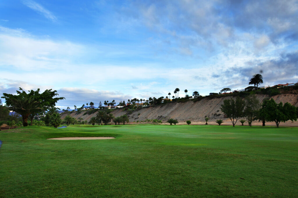 Fairway with bunker and trees around at Campo de Golf de Maspalomas