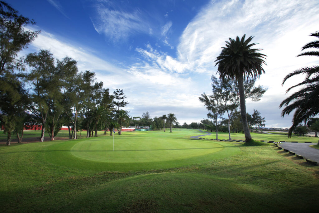 Hole with trees around at Campo de Golf de Maspalomas