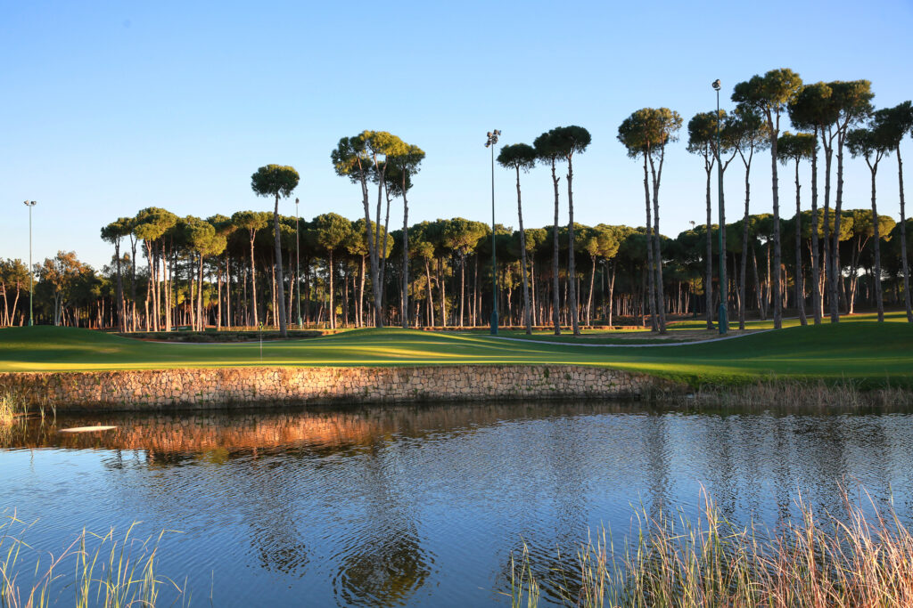 Lake with trees in background at Carya Golf Course