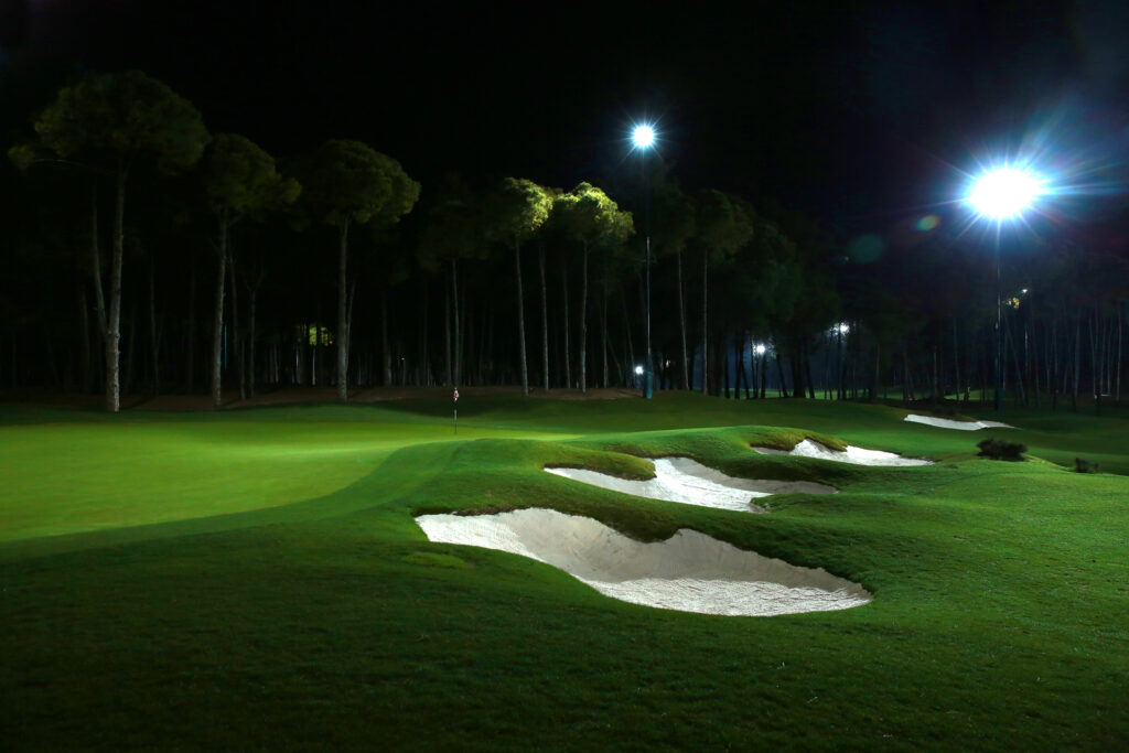 Hole with bunkers and trees around at Carya Golf Course