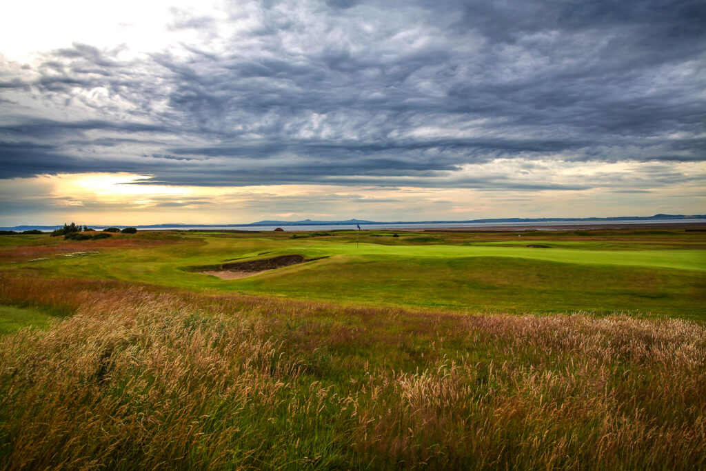 Fairway leading to hole with bunker at Craigielaw Golf Club