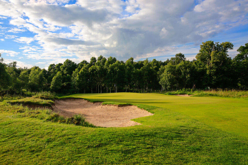 Bunker on fairway at The Dukes Course with trees around