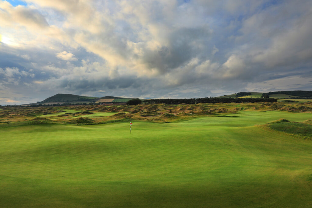 Hole with fairway and trees around at Dumbarnie Links