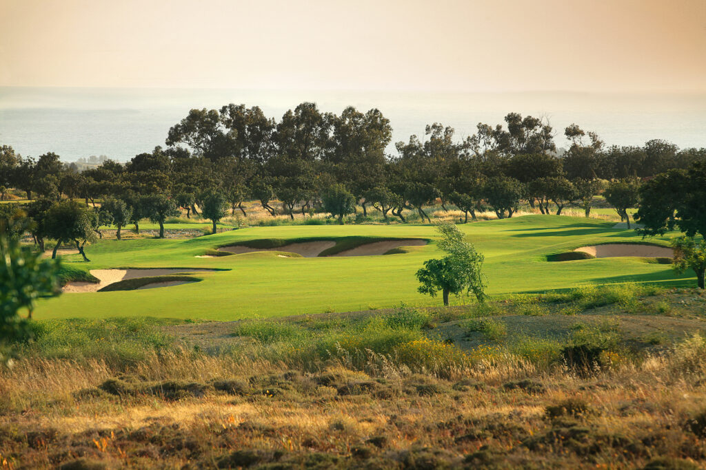 Hole with bunkers and trees around at Elea Golf Club