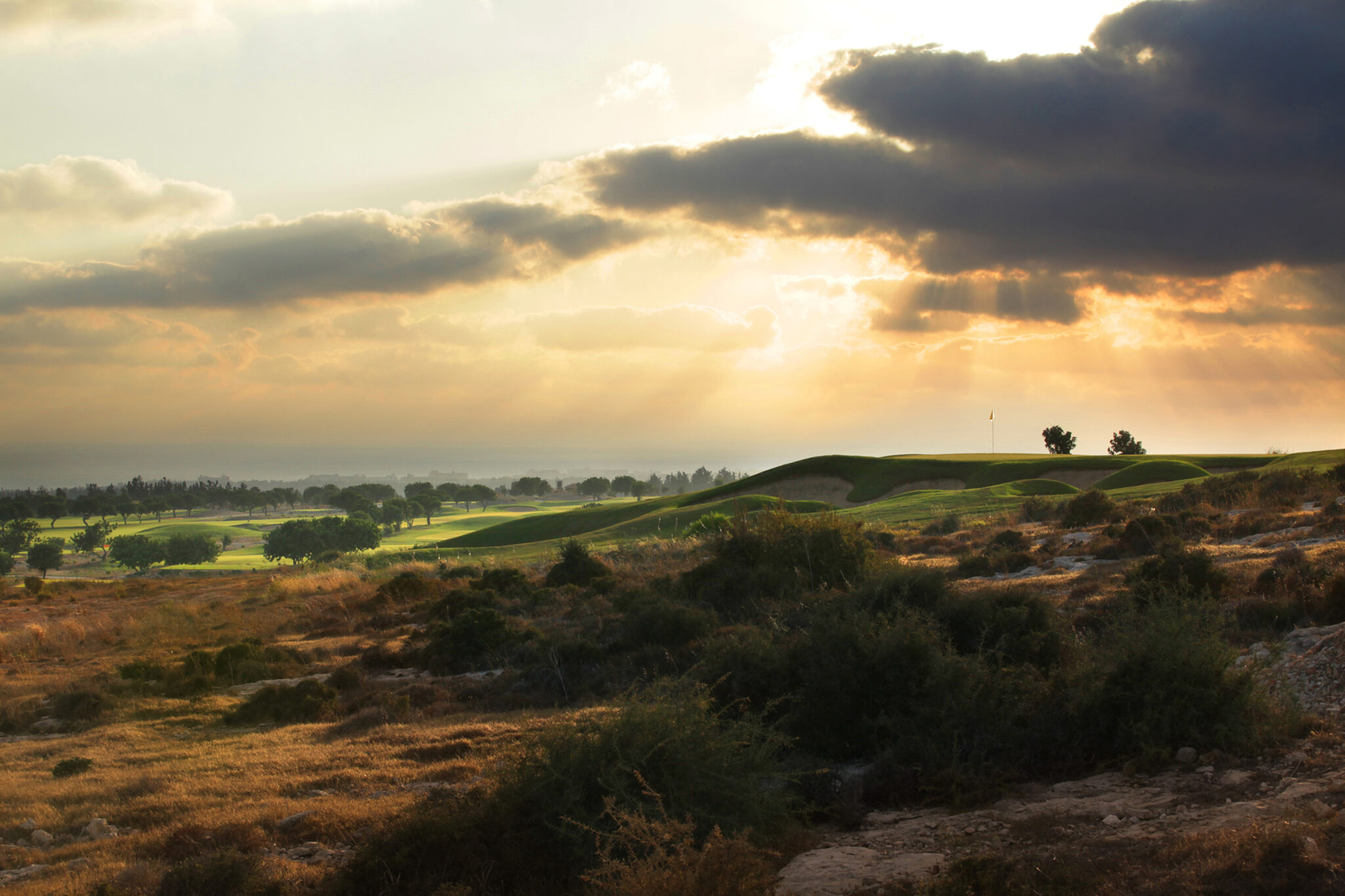 Fairway at Elea Golf Club with sun shining down