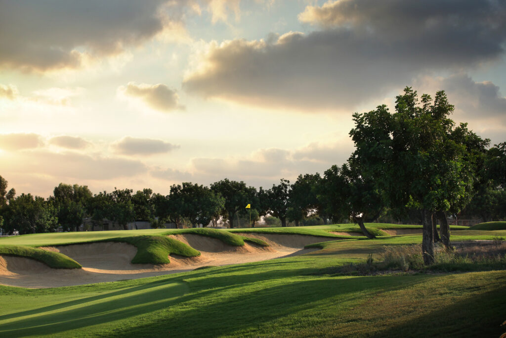 Hole with bunkers with trees around at Elea Golf Club