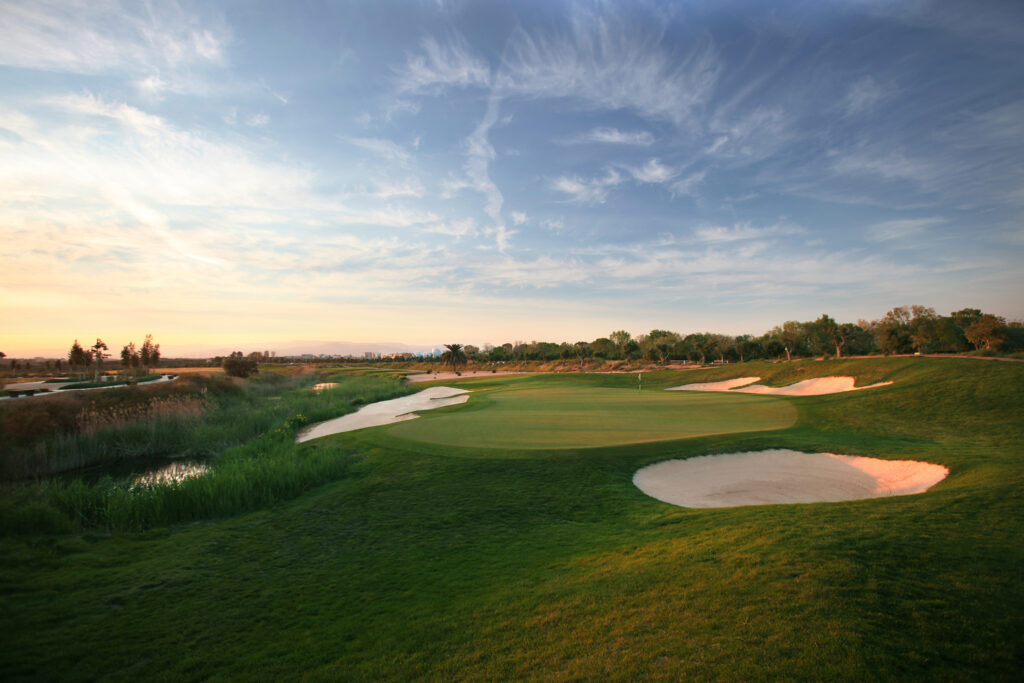 Bunkers around a hole at Infinitum Lakes Course