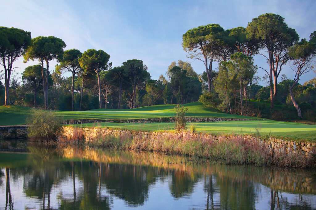 Lake on fairway at Kaya Palazzo Golf Club with trees around